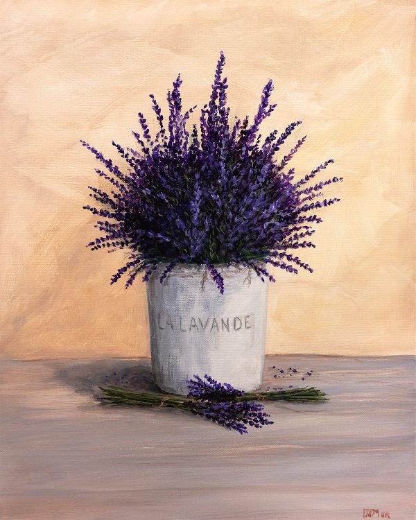 Pot of lavender plants against rustic wall